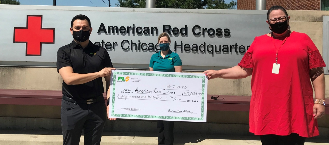 PLS Employees Holding Donation Check